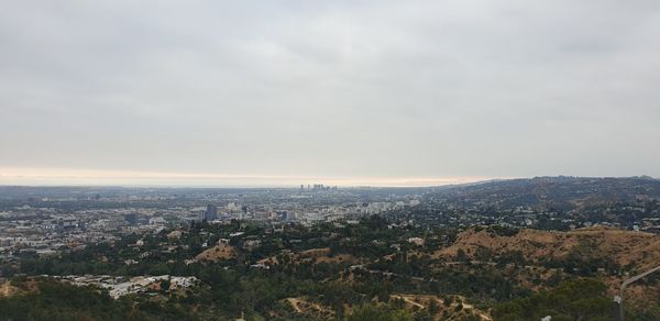 High angle view of buildings in city against sky