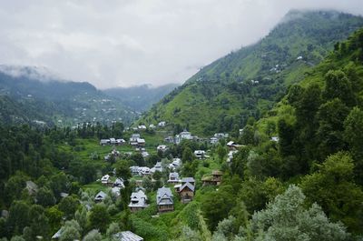 High angle view of houses and mountains against sky