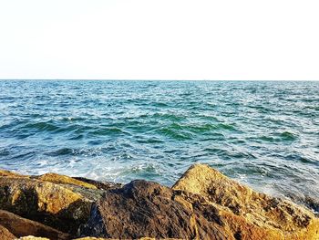Scenic view of sea against clear sky