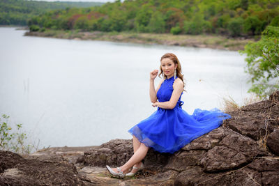 Portrait of smiling young woman in water