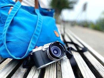 Close-up of camera photographing on wood