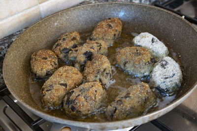 High angle view of meat in cooking pan