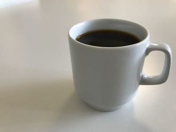 Close-up of coffee cup on table