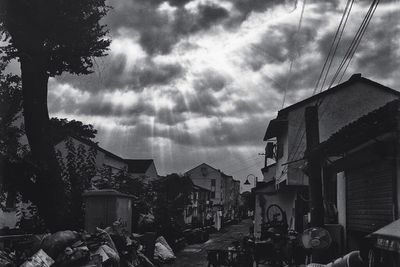 Buildings against cloudy sky