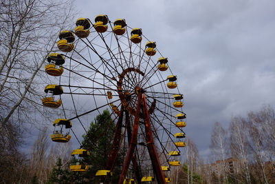 Low angle view of ferris wheel against sky