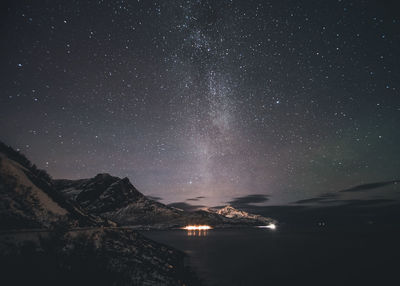 Scenic view of sea against sky at night