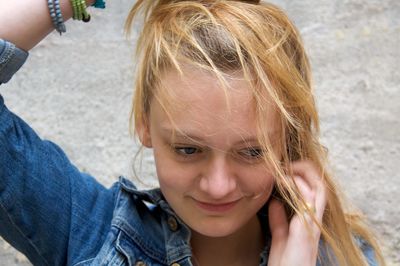 High angle view of smiling teenage girl on road