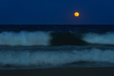 Scenic view of sea against sky at night