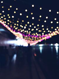 Defocused image of illuminated lights at night
