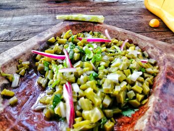 High angle view of chopped vegetables in bowl on table