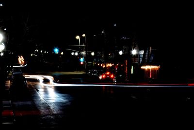 Illuminated city street at night