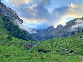 Scenic view of landscape and mountains against sky