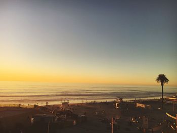 Scenic view of beach against sky during sunset