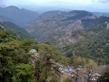 High angle view of trees and mountains against sky