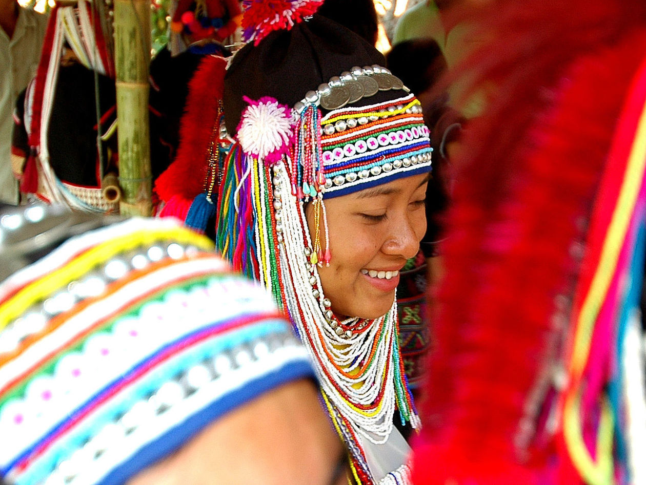 CLOSE-UP OF SENIOR MAN WEARING MULTI COLORED TRADITIONAL CLOTHING