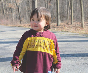 Portrait of cute girl standing in park