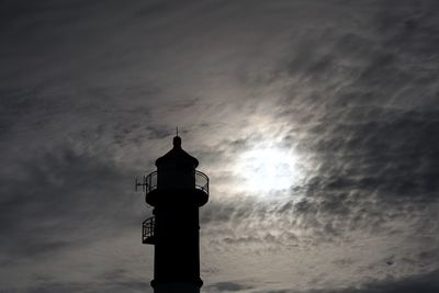 Low angle view of lighthouse against sky during sunset