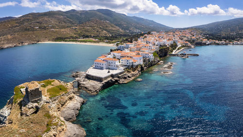 High angle view of sea and buildings against sky