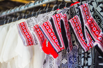 Close-up of clothes hanging on display at store