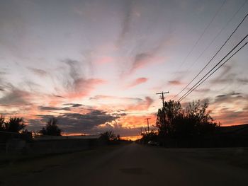 Dramatic sky over road during sunset