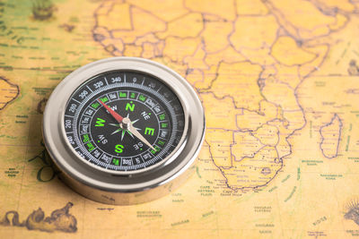 Close-up of navigational compass on table