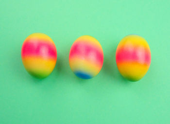 Close-up of multi colored candies against blue background