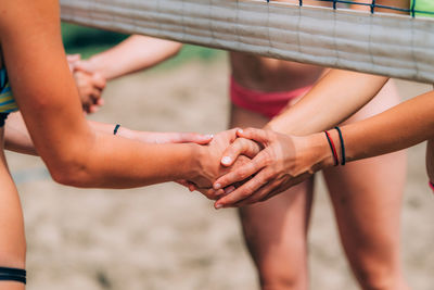 Beach volleyball girls shaking hands after the match