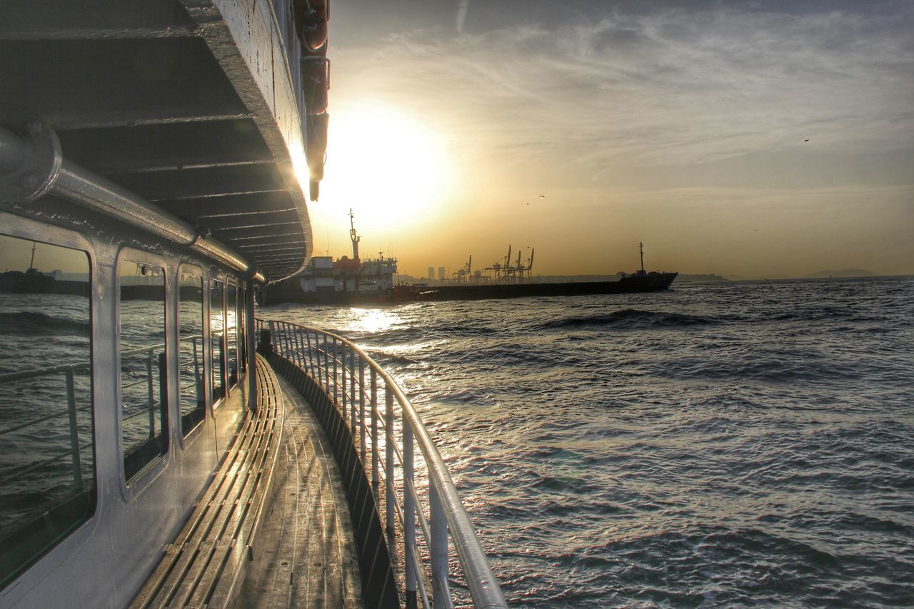 water, sea, transportation, sunset, sky, the way forward, pier, railing, built structure, sun, diminishing perspective, sunlight, connection, rippled, tranquility, long, vanishing point, nature, horizon over water, tranquil scene