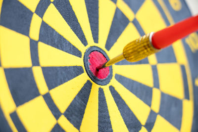 Close-up of arrow on dartboard