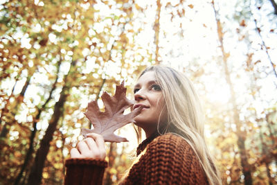 Portrait of young woman in forest