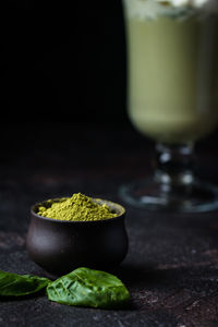 Close-up of vegetables on table against black background