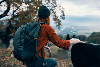 Rear view of woman riding horse