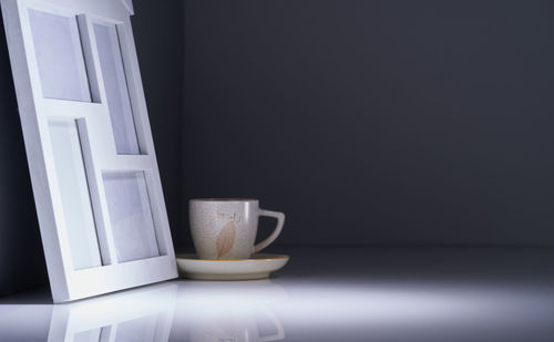 Close-up of coffee cup on table