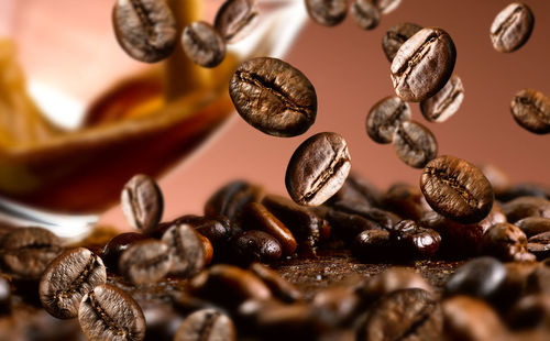 Close-up of coffee beans on table
