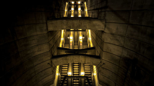 Low angle view of illuminated building at night