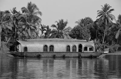 Calm sea with buildings in background