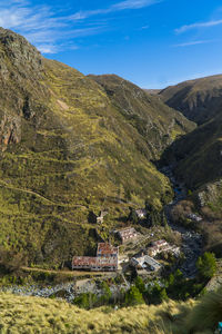 High angle view of houses and mountains against sky