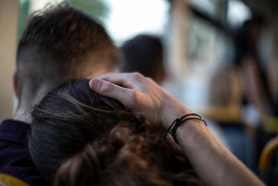 Rear view of woman with hands