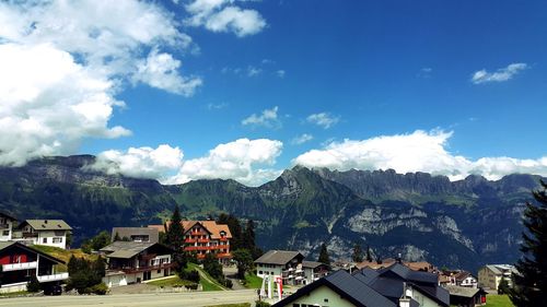 Scenic view of mountains against cloudy sky