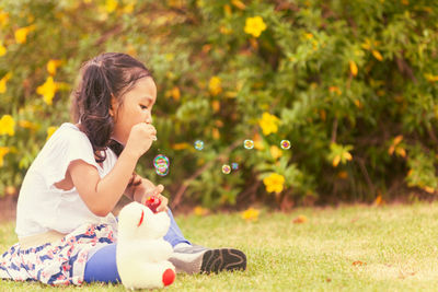 Girl sitting on field