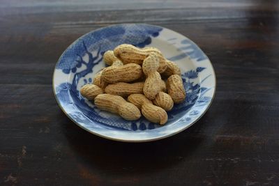 Directly above shot of peanuts in plate 