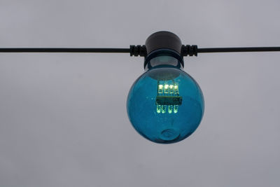 Low angle view of illuminated light against sky