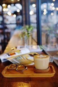 Close-up of coffee served on table at cafe