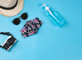 High angle view of bottle on table against blue background
