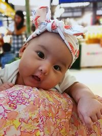 Portrait of cute baby wearing bandanna