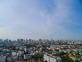 High angle view of buildings in city against sky