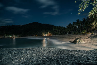 Scenic view of sea against sky at night