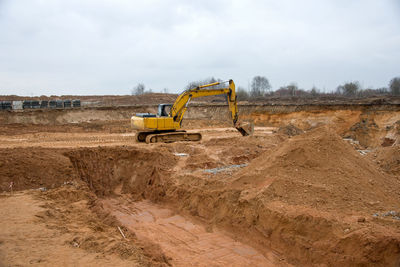 Construction site on field against sky