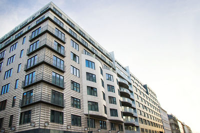 The building in berlin center, evening time, windows and night lights.