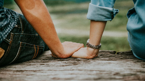 Low section of man and woman standing outdoors